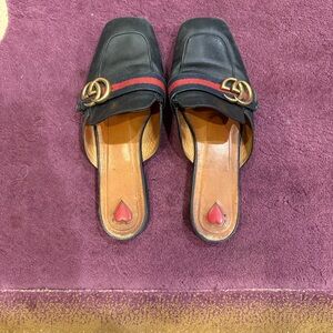 Gucci Black Flats with Gold Emblem and Red Stripe